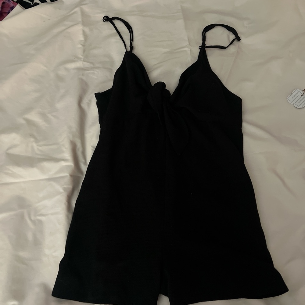 Black romper with bow tie front and open back